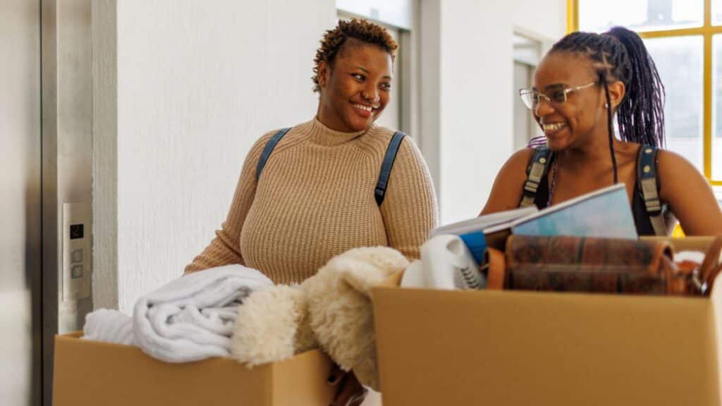 Student Flatmates Moving Into College Dorm